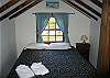 The master's bedroom of the Tram View Chalet is located on the second floor, and enjoys a new Queen size bed.