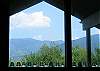 This is the view from inside looking out... through an entire wall of glass.  This is standing in the middle of the living room and the major peaks you see are Mount Lafayette, Cannon and Mittersill.