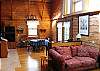 The Open concept continues through-out the interiors of this home as can be seen here.  The family will be facing all the fun that this wonderful White Mountain Log Home has to offer.