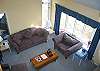 The 'lofty view' of Village of Maplewood #40's living area provideas a birds eye view on the comfort that is sure to be enjoyed by family and friends.  The great bay window looks out onto a wooded setting with distant sunset views when times are right.