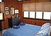 The set-up of the Ridge Top Family Trust home is simply perfect for two families to enjoy in total comfort.  The left & ride sides of the home are equally outfitted with a Master bedroom with queen bed, such as this.  More picture filled windows too.