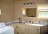 The one bath in Tuck-Away is a sizable one, offering a full size washer and dryer plus the usuals of course.