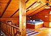 The entire second floor of the Berry Patch Place makes for a Master Suite with it's own bath, movie-n-game tv station and a queen size ftuon couch-n-bed.  If it's a warm and comfy Log Home you've been looking for... Fount It!