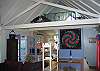 This would be standing on the edge of the Franconia Storybook Cottage Living Area looking up into the loft and beyond to the kitchen which is below it.