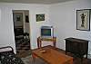 Living area isn't fancy though it is cozy and enjoys a view toward one of the town's historic preservation spots.