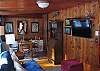 The sitting porch was once a three season, but has since been converted to a four season room and it doubles as the second sleeping area offering a queen futon.