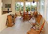 The corner dining area on the top floor has a large table and a great view.
