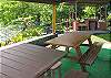 Guests spend most of their time right here at the picnic tables and barbecue, with a dip now and then to swim with the turtles!