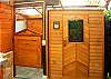 The outdoor tropical bathroom features both a sauna and a jetted tub.