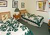 Two twin beds in Bedroom 3.