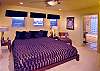 The master bedroom on the top floor has a king bed. All bedrooms have en suite baths and two have their own TVs.