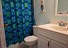 The bathroom is clean and colorful.