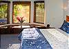 The queen platform bed in the main floor bedroom is new and comfortable. The view over the window seat will remind you that you are definitely in Hawaii!