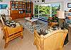 Living area with ocean views, entertainment center and library.