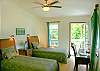 Another elegant bedroom with twin beds, private bath, your own work space, and a private lanai.