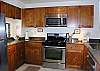 The beautifully updated kitchen is rich, bright, and fully equipped. Don't forget the barbecue areas by the pools!