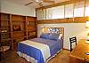 The second bedroom has a Full sized bed, book shelves and a small desk if you really must work while visiting Hawaii!
