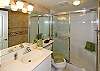 The full bath is just off the master bedroom and offers a walk-in shower.