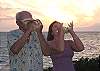 A tradition at Surfside--conch blowing on the lawn at sunset.