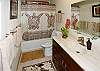 The two beautifully upgraded bathrooms have tubs and showers.