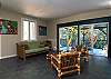 Enjoy the waterfall and garden views from every angle of the living room
