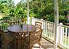 The lanai has a comfortable area for outdoor dining. There is also a barbecue for use by guests.
