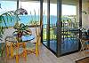 The dining area offers comfortable seating for four and a great view.