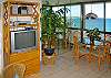 The entertainment center has cable TV, a DVD and CD/radio, free high-speed Internet, and the mirrored wall by the dining table gives everyone a view!