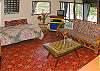 The living area is cozy and offers a single bed for sleeping when you have a larger group, or maybe for that afternoon nap!