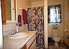 The guest bathroom opens onto the Living Area