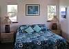 A king bed and private en suite bath with a large shower make up one of the two bedrooms.
