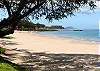 Just walk across the street and let the sand slip through your toes at Kamaole II Beach.