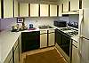 Dishwasher and microwave as well as small appliances and lots of dishes make this kitchen fully equipped for your convenience.