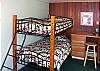 A third bedroom with bunk beds is off the downstairs lanai.