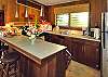 A full kitchen has all the standard appliances along with cookware and servingware.