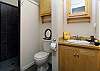 Elegant built-ins and walk-in shower in the second bathroom