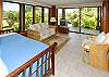 The downstairs den has ocean and garden views, its own TV/DVD, and two twin beds.