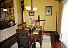 The formal dining area is comfortable for six and hosts views of the lanai and ocean.