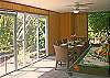 Dining for 8 "outdoors" on the screened-in patio area. Just outside the door are the steps to the tide pool.