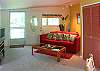 The living room has a sleeper sofa and full entertainment center with satellite TV, DVD and full stereo system.