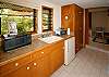 The downstairs kitchenette has a sink, mini-refrigerator, microwave, and toaster oven.