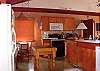 The large upstairs kitchen. There's also a kitchenette downstairs.