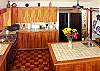 The roomy kitchen has everything you'll need to prepare and serve meals.