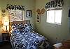 The Bedroom off the living room has a Full size bed and dresser for clothing storage.