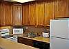 The galley kitchen has a dishwasher, all the dishes and pots and pans you need, and a blender for those slushy cool drinks!