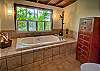 Soak in the jetted tub in one of two master suites.