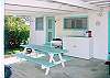 The Cottage has a covered lanai (porch) with picnic table and barbeque for your outdoor dining pleasure.