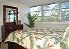 The queen-bedded master bedroom faces the ocean and also has a work desk with high-speed Internet and an en suite bath.