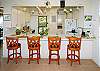 Lagoon House has a large, comfortable kitchen and breakfast bar. The high-speed Internet modem and phone are on the counter.