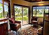 Read or hang out in the small, indoor living room, adjacent to the kitchen.